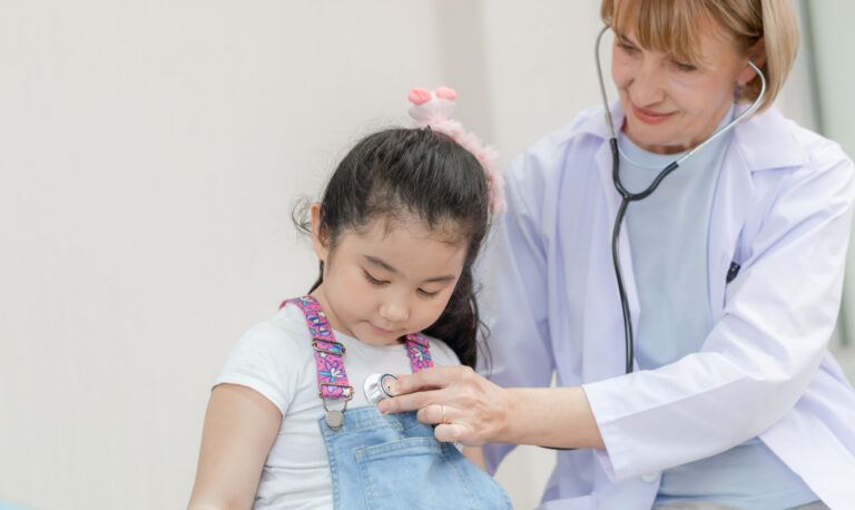 Doctor checking child's lungs with stethoscope